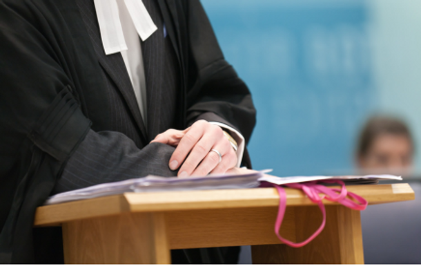 Close-up of the hands of a barrister while talking.